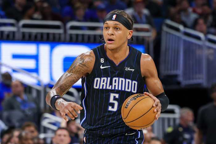 Orlando Magic forward Paolo Banchero dribbles the ball.